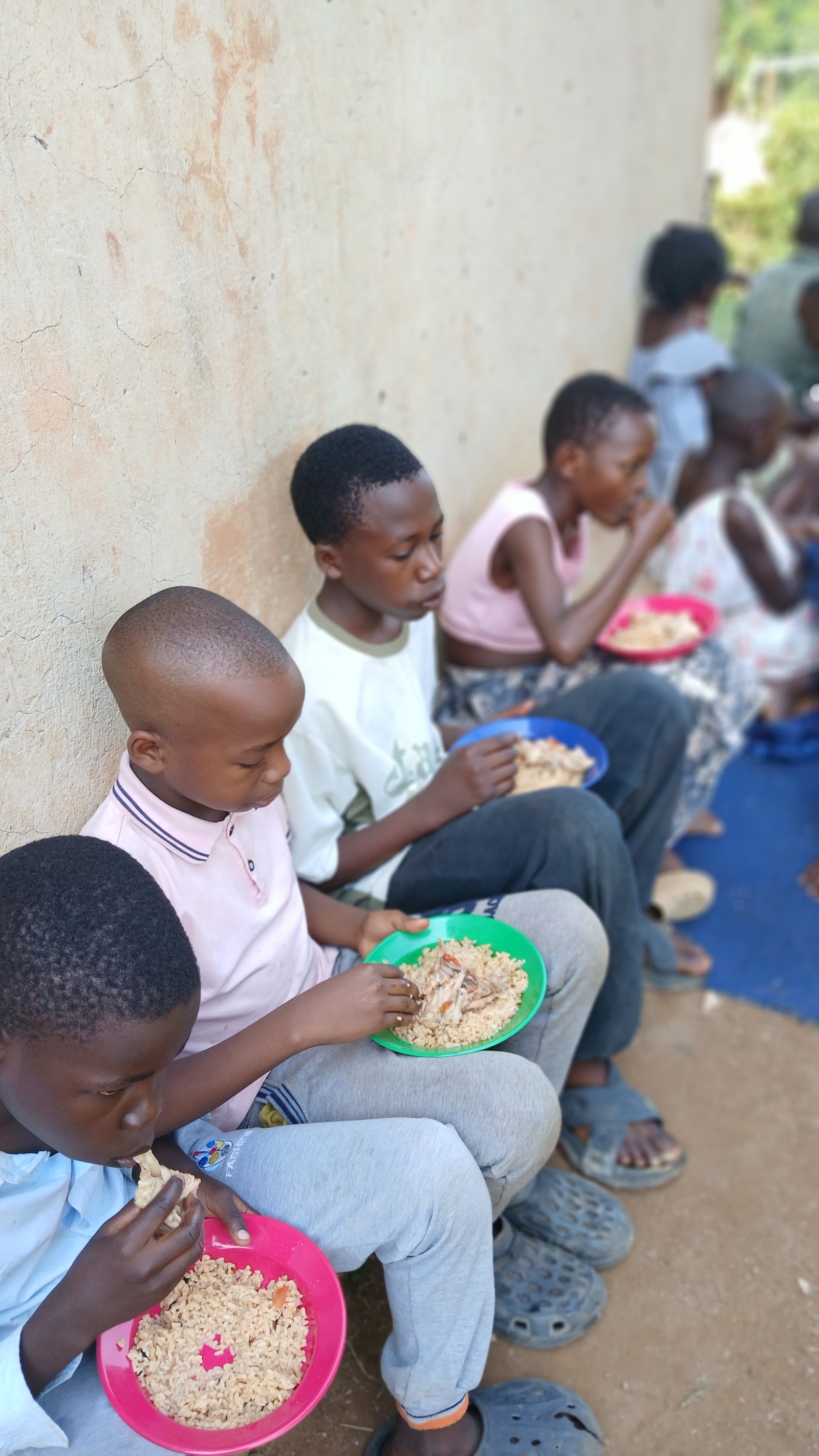 Children sitting together and sharing a meal