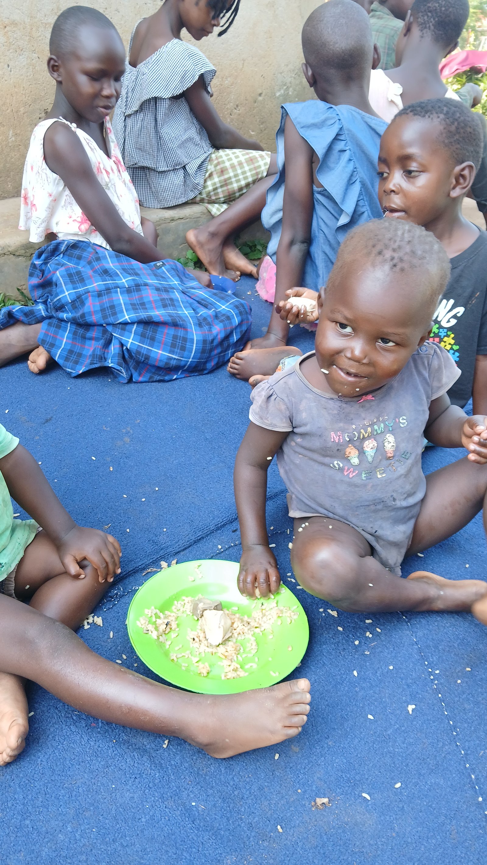 Children gathered around plates of food